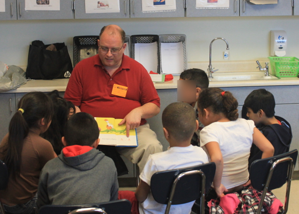 David Rodeback reading Dr. Seuss to third-graders at Woodrow Wilson Elementary.